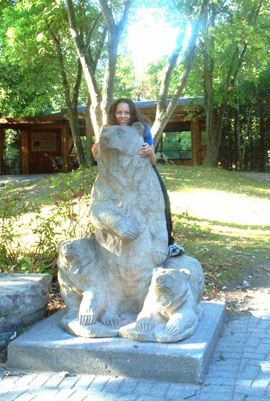 cheena on statue.jpg - Cheena and a bear at Toronto Zoo